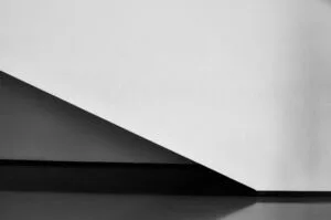 A staircase and wall captured in black and white colors