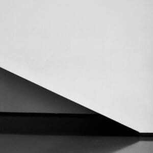 A staircase and wall captured in black and white colors