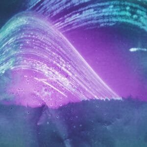 A vibrant purple and green wave against a serene blue background